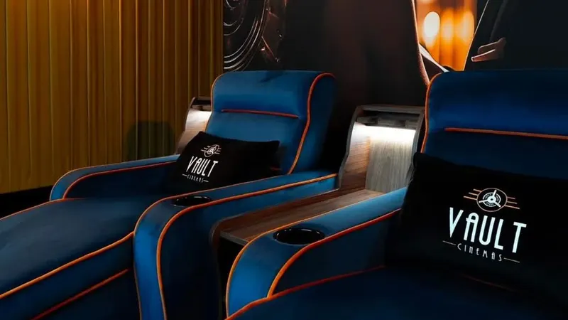 Velvet recliner seats with Vault Cinemas branding at the boutique cinema beneath Real Food Hall